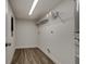 Laundry room with shelving and vinyl flooring at 318 Senate St, Auburndale, FL 33823