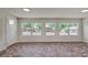 Bright dining area with terracotta patterned flooring and view of backyard at 318 Senate St, Auburndale, FL 33823