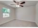 Bright bedroom with ceiling fan and neutral carpeting at 318 Senate St, Auburndale, FL 33823