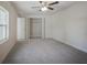 Spacious bedroom with ceiling fan and large closet at 318 Senate St, Auburndale, FL 33823