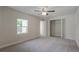Bright bedroom featuring grey carpet and a ceiling fan at 318 Senate St, Auburndale, FL 33823