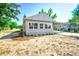 Newly renovated single story home with carport and landscaped front yard at 318 Senate St, Auburndale, FL 33823
