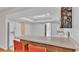 Kitchen features wood cabinets and a breakfast bar at 3479 Arrowwood Dr, Lakeland, FL 33811
