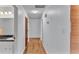 Light and bright hallway with wood-look flooring at 3479 Arrowwood Dr, Lakeland, FL 33811