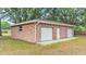 Brick three-car garage with ample space and convenient side door at 3479 Arrowwood Dr, Lakeland, FL 33811