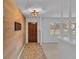 Inviting entryway with wood-like wall and tile flooring at 3479 Arrowwood Dr, Lakeland, FL 33811