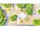 Aerial view of single-story home with large yard and surrounding trees at 3479 Arrowwood Dr, Lakeland, FL 33811