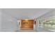 Spacious living area with large windows and wood accent wall at 3479 Arrowwood Dr, Lakeland, FL 33811