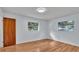 Bedroom with wood flooring and two windows at 3479 Arrowwood Dr, Lakeland, FL 33811