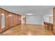 Spacious living area with wood paneling and hardwood floors at 3479 Arrowwood Dr, Lakeland, FL 33811