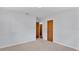 Spacious bedroom with two doors and carpet at 3479 Arrowwood Dr, Lakeland, FL 33811
