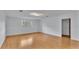 Spacious living room featuring light walls and wood flooring at 3479 Arrowwood Dr, Lakeland, FL 33811