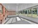 Bright and airy screened porch with brick walls and concrete flooring at 3479 Arrowwood Dr, Lakeland, FL 33811