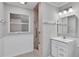 Bathroom boasts a walk-in shower, updated vanity, and tile flooring at 3479 Arrowwood Dr, Lakeland, FL 33811