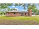 Red brick house exterior with mature landscaping at 3479 Arrowwood Dr, Lakeland, FL 33811