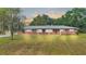 Brick ranch home with spacious lawn and mature trees at 3479 Arrowwood Dr, Lakeland, FL 33811