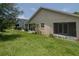 Exterior view of the house showcasing a screened-in patio and backyard at 6118 Silver Lakes W Dr, Lakeland, FL 33810