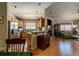 Open kitchen with breakfast bar, stainless steel appliances, and view of living room at 6118 Silver Lakes W Dr, Lakeland, FL 33810