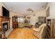 Living room with fireplace, hardwood floors, and comfy seating at 6118 Silver Lakes W Dr, Lakeland, FL 33810