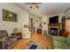 Open living room with hardwood floors and view of kitchen at 6118 Silver Lakes W Dr, Lakeland, FL 33810