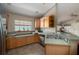 Kitchen with light wood cabinets, stainless steel appliances, and tile floors at 6118 Silver Lakes W Dr, Lakeland, FL 33810