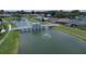 Peaceful community lake with a footbridge and gazebo at 6118 Silver Lakes W Dr, Lakeland, FL 33810