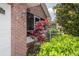 Front view of the house, showcasing brick facade and landscaping at 6118 Silver Lakes W Dr, Lakeland, FL 33810