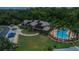Community pool with a clubhouse and surrounding landscape at 6118 Silver Lakes W Dr, Lakeland, FL 33810