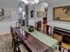 Bright dining room with hardwood floors and views into Gathering room at 745 Square Lake E Dr, Bartow, FL 33830
