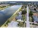 Aerial view of neighborhood, showcasing the lake and homes at 745 Square Lake E Dr, Bartow, FL 33830