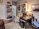 Home office features built-in bookshelves, a comfortable chair, and a workspace at 745 Square Lake E Dr, Bartow, FL 33830