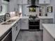 Modern kitchen with stainless steel appliances and quartz countertops at 745 Square Lake E Dr, Bartow, FL 33830