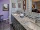 Double vanity bathroom with quartz countertop and modern fixtures at 745 Square Lake E Dr, Bartow, FL 33830