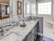 Elegant bathroom with double vanity, updated shower, and mosaic tile at 745 Square Lake E Dr, Bartow, FL 33830