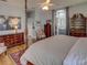 King-size bed, two dressers, and sitting area with chair at 745 Square Lake E Dr, Bartow, FL 33830