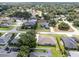 Aerial view of a residential neighborhood with houses and a lake at 745 Square Lake E Dr, Bartow, FL 33830