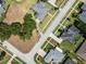 An aerial view of a residential lot with surrounding houses at 745 Square Lake E Dr, Bartow, FL 33830