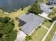 Aerial view of house, showcasing lakefront location and landscaping at 745 Square Lake E Dr, Bartow, FL 33830