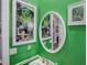 Green bathroom with updated sink and fixtures, and framed art at 745 Square Lake E Dr, Bartow, FL 33830