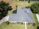 Aerial view of house highlighting the roofline and landscaping at 745 Square Lake E Dr, Bartow, FL 33830