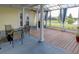 Extended screened patio with deck and lake view at 745 Square Lake E Dr, Bartow, FL 33830