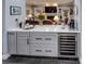 Small kitchenette with sink, wine cooler, and quartz countertop at 745 Square Lake E Dr, Bartow, FL 33830