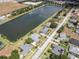 Aerial view of lakefront homes and lush green landscape at 745 Square Lake E Dr, Bartow, FL 33830