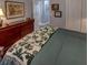 Serene bedroom with plush bedding and hardwood floors at 745 Square Lake E Dr, Bartow, FL 33830