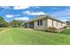 Single-story house with screened porch and water view at 8288 Lake James Dr, Lakeland, FL 33810