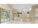 Bright Gathering room with hardwood floors and sliding glass doors at 8288 Lake James Dr, Lakeland, FL 33810