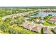 Aerial view of a large community with houses and lake at 8288 Lake James Dr, Lakeland, FL 33810