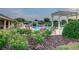 Relaxing pool area with lounge chairs and pergola at 8288 Lake James Dr, Lakeland, FL 33810