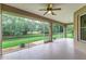 Spacious screened porch overlooking a backyard and canal at 8288 Lake James Dr, Lakeland, FL 33810