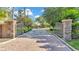 Gated entrance to Lake James community with brick pavers at 8288 Lake James Dr, Lakeland, FL 33810